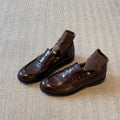 Retro ankle boot slippers for women with thick heels and flat sole. English style leather shoes. Loafers.